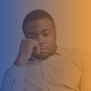 Man in shirt looking pensive