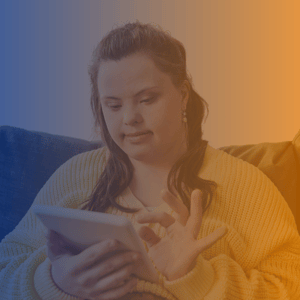 Woman with Down Syndrome wearing yellow shirt