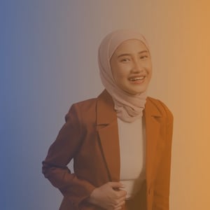 Female Muslim teen wearing a blazer on blue to orange gradient background